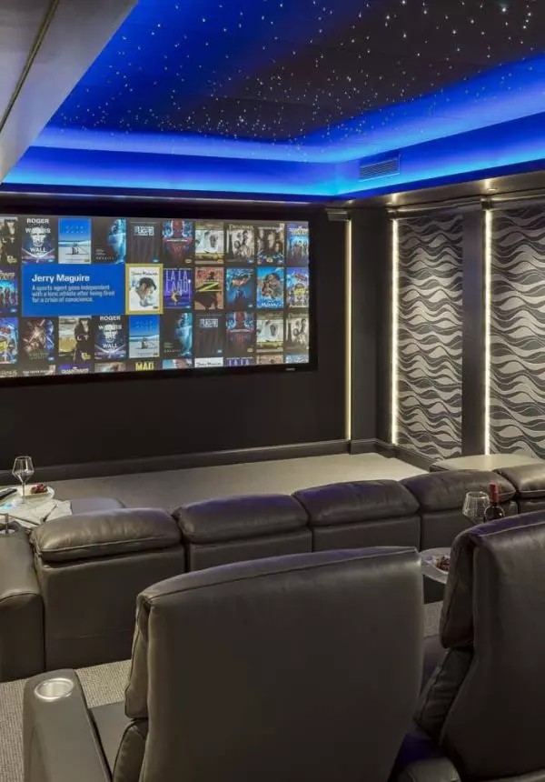 home theater with blue LEDs and kaleidescape screen