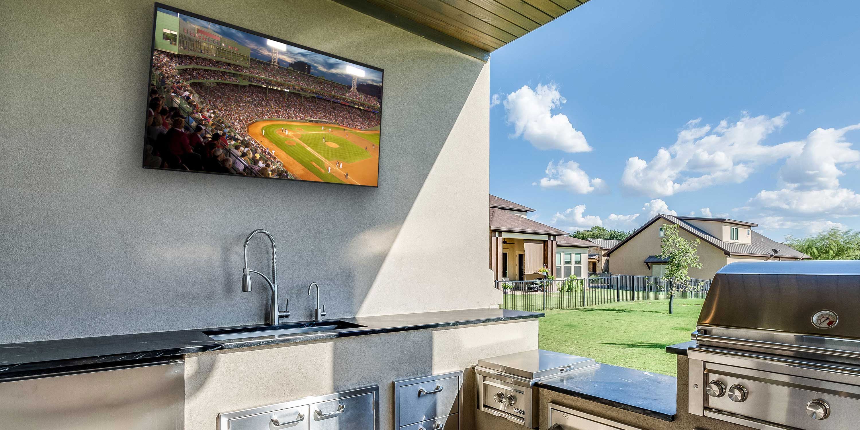 outdoor kitchen with TV