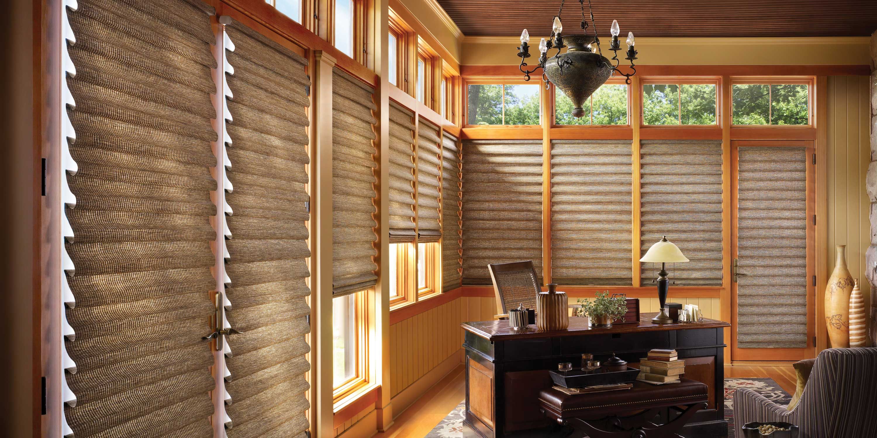 home office with warm wood tones and hunter douglas shades