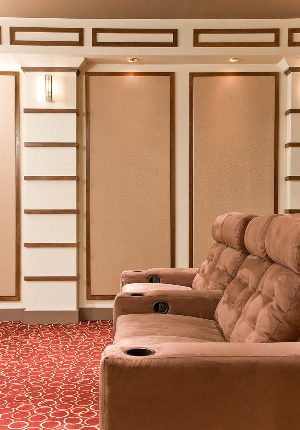 Beige couch and wall panels in home theater