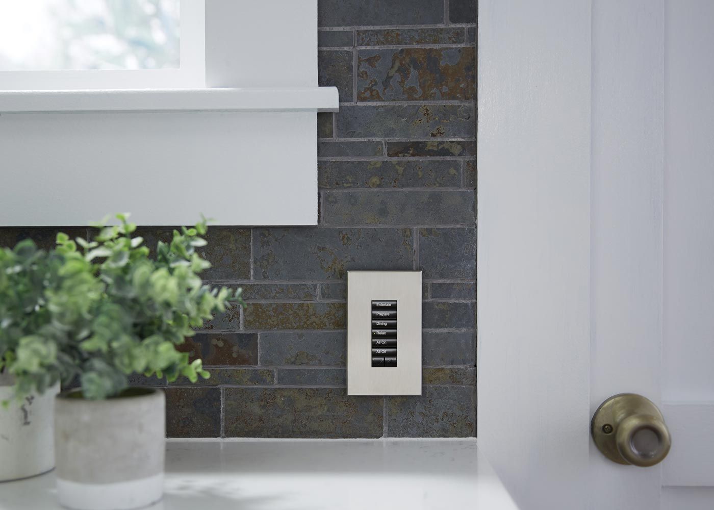 View of Lutron touchpanel on brick wall